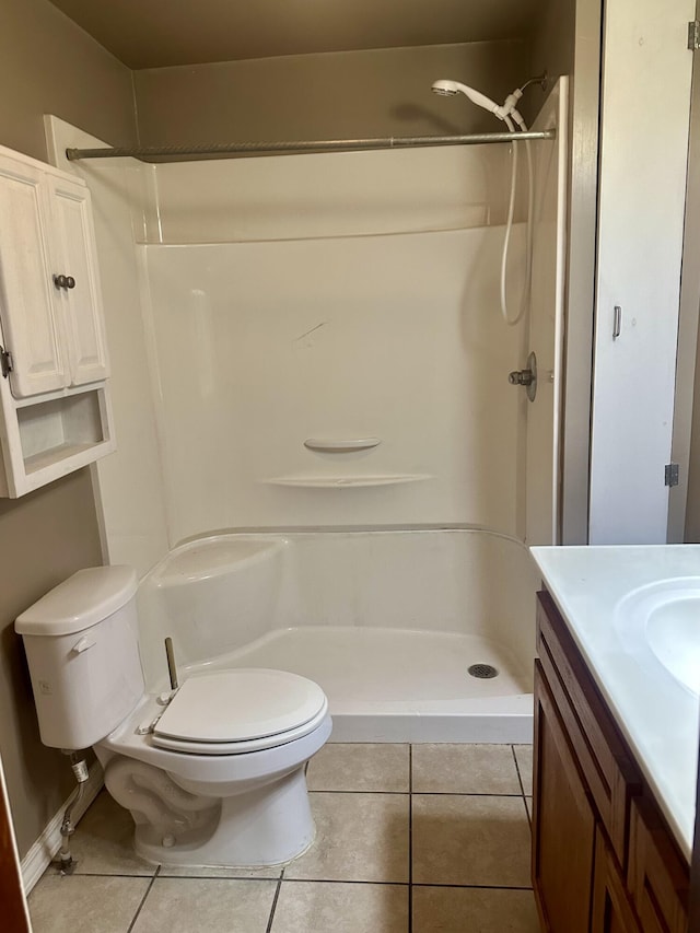 full bathroom with tile patterned floors, vanity, toilet, and a shower stall