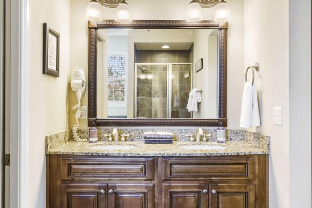 201 Prairie Dunes Dr Unit 1307/1308, Branson, MO 65616 - full bath with a sink, double vanity, and a shower stall