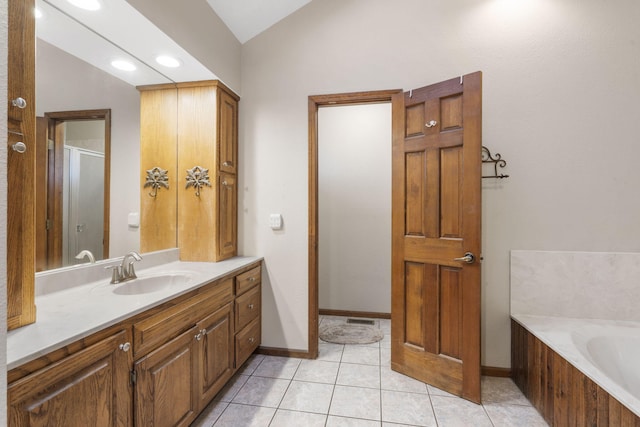 full bathroom with tile patterned floors, a garden tub, a stall shower, vanity, and vaulted ceiling