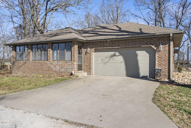 view of front of property featuring brick siding, roof with shingles, concrete driveway, and an attached garage