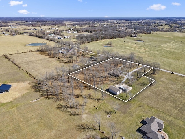 birds eye view of property with a rural view