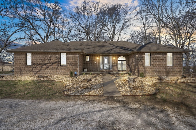 ranch-style house with brick siding