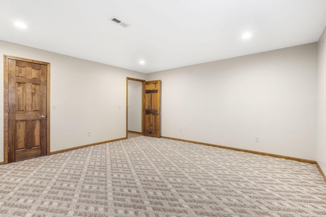 unfurnished bedroom featuring visible vents, recessed lighting, carpet, and baseboards