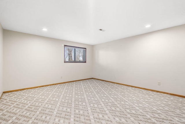 spare room featuring visible vents, recessed lighting, baseboards, and carpet floors