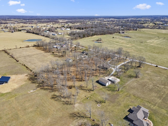 birds eye view of property featuring a rural view