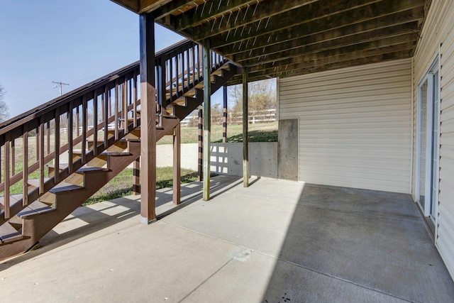 view of patio featuring stairway