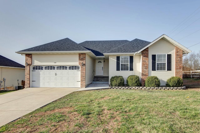 ranch-style house featuring a front yard, driveway, an attached garage, a shingled roof, and brick siding