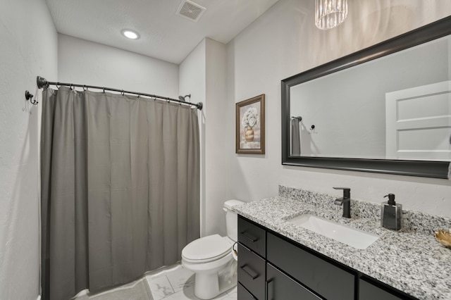 bathroom with visible vents, toilet, marble finish floor, a shower with shower curtain, and vanity