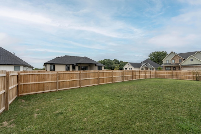 view of yard with a fenced backyard