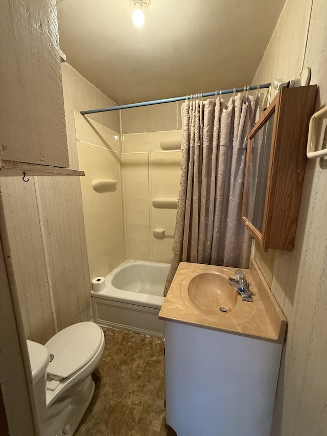 bathroom featuring shower / bathtub combination with curtain, toilet, and vanity