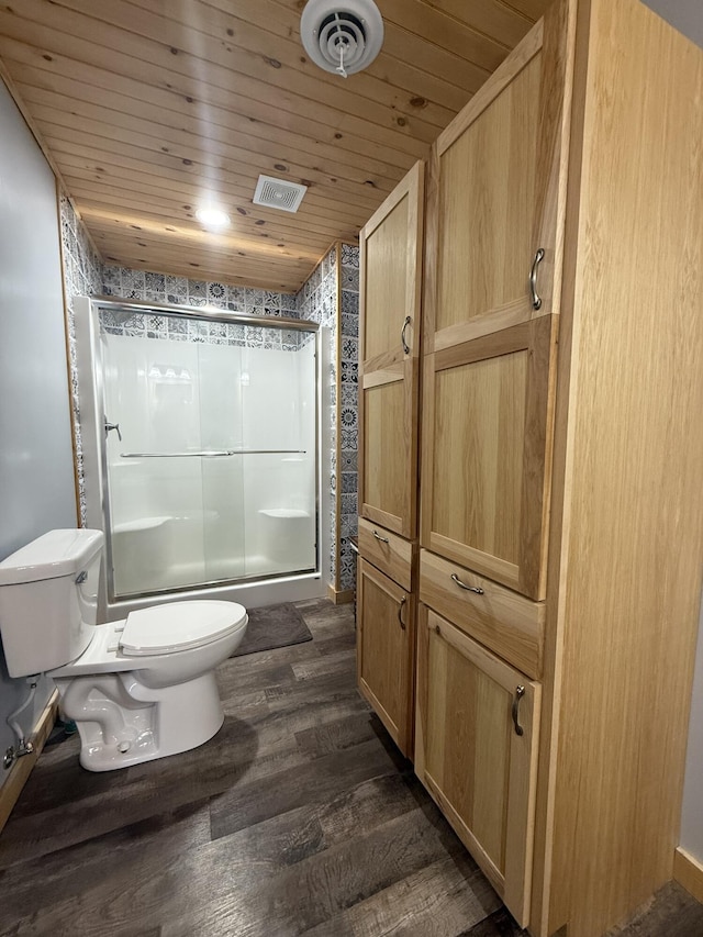 full bath with visible vents, toilet, wood finished floors, a shower stall, and wood ceiling