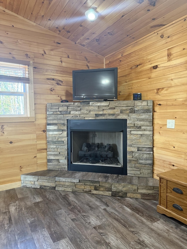 room details with wood finished floors, wooden walls, a fireplace, and wooden ceiling