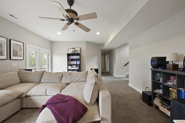 living room with visible vents, a ceiling fan, stairway, carpet flooring, and baseboards