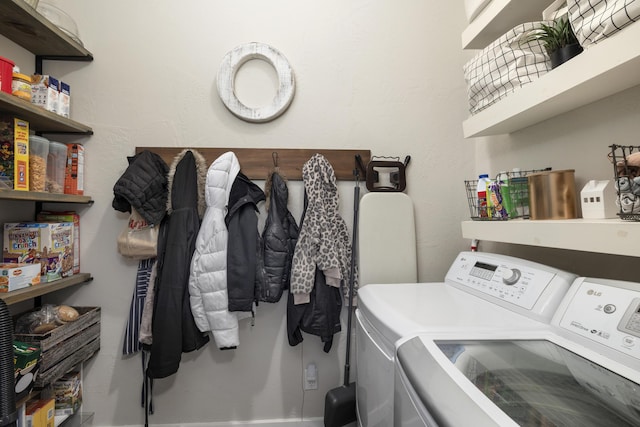 laundry room featuring laundry area and washing machine and clothes dryer