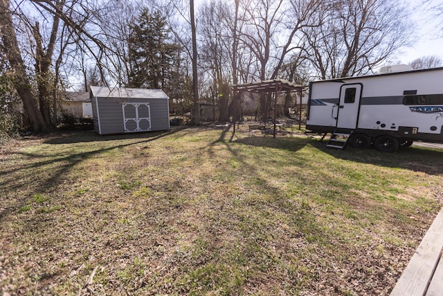 view of yard with an outbuilding and a storage unit