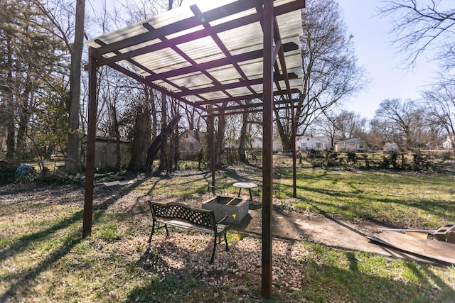 view of home's community featuring a lawn and a pergola