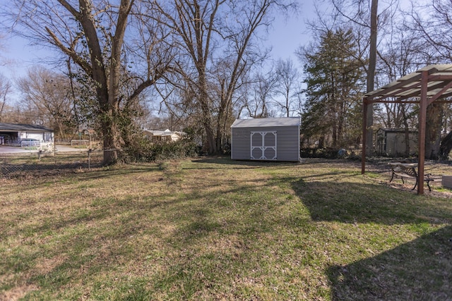 view of yard with a storage shed, an outdoor structure, and fence