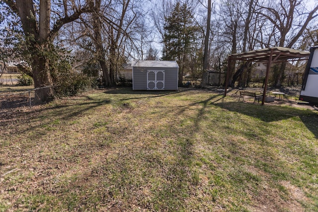 view of yard featuring a storage shed, an outdoor structure, and fence