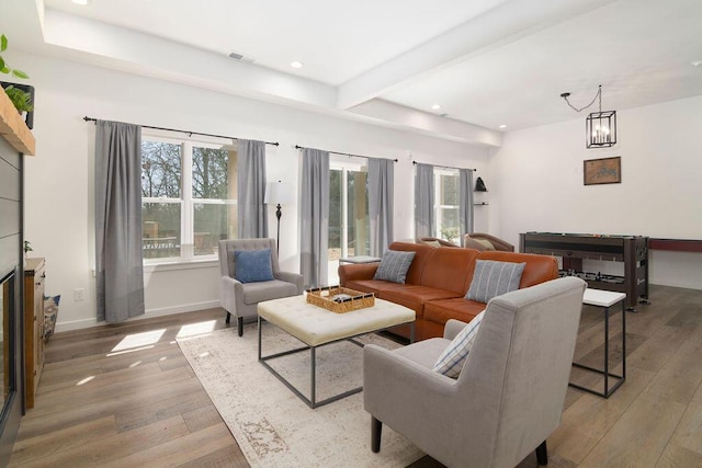 living room featuring visible vents, beam ceiling, recessed lighting, wood-type flooring, and baseboards