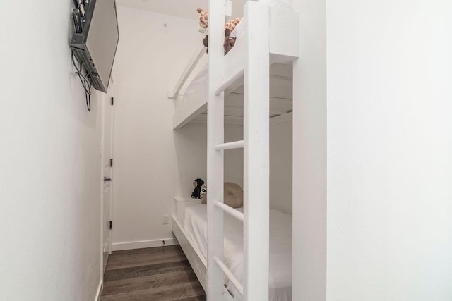 mudroom featuring baseboards and wood finished floors