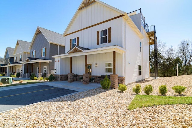 view of front of home featuring uncovered parking and board and batten siding