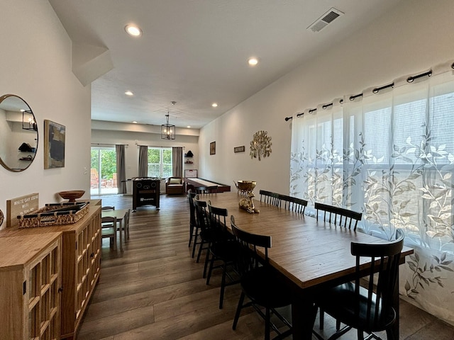 dining room featuring dark wood-type flooring, recessed lighting, and visible vents