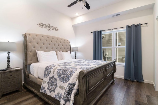 bedroom with baseboards, visible vents, dark wood-style flooring, and ceiling fan