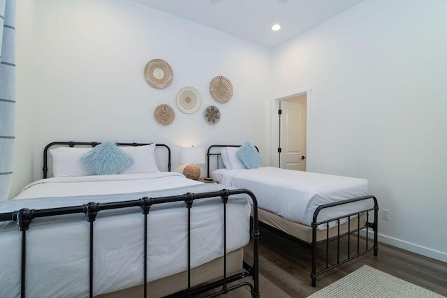 bedroom featuring recessed lighting, wood finished floors, and baseboards