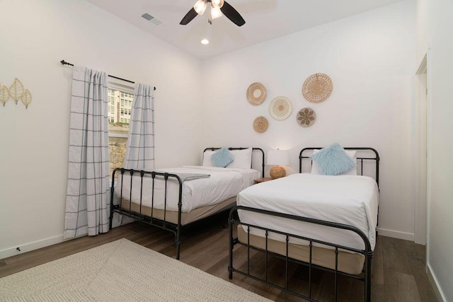 bedroom with recessed lighting, wood finished floors, visible vents, and baseboards