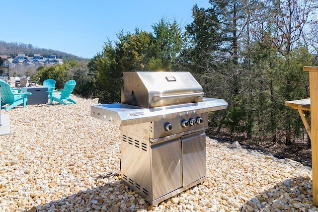 view of patio / terrace with grilling area and a fire pit