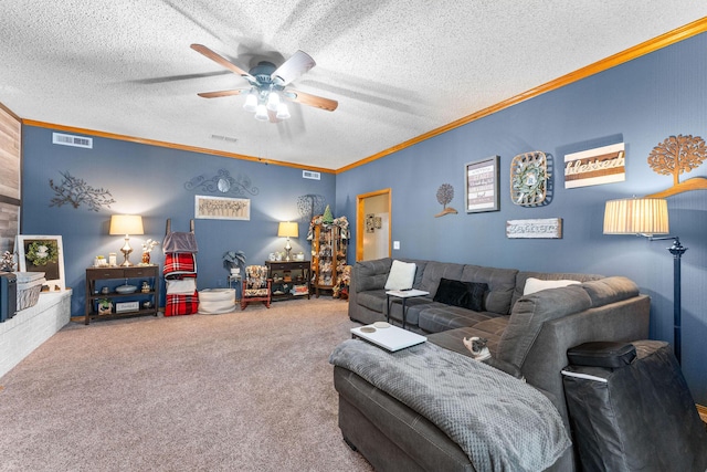 carpeted living room with a textured ceiling, ornamental molding, visible vents, and ceiling fan