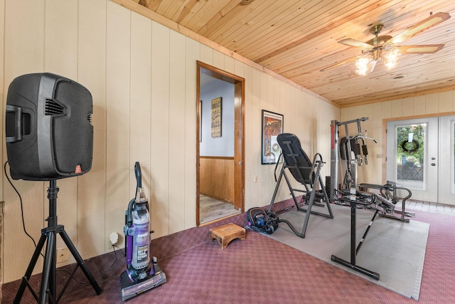 exercise room featuring a ceiling fan, wood ceiling, and french doors