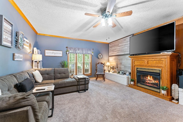 carpeted living area with wooden walls, ceiling fan, crown molding, and a textured ceiling