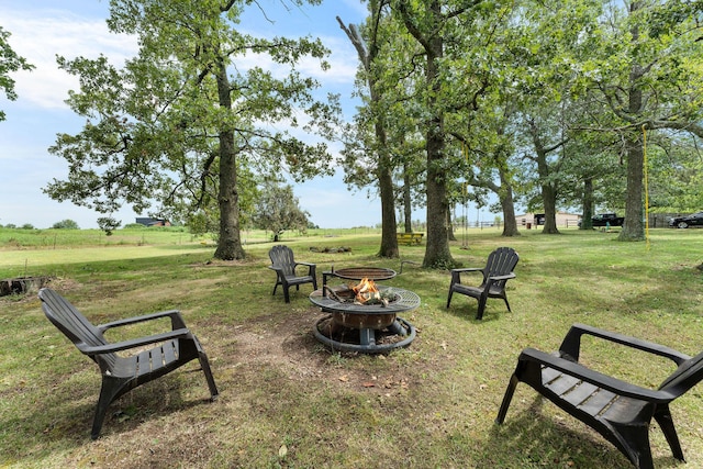 view of yard with a fire pit