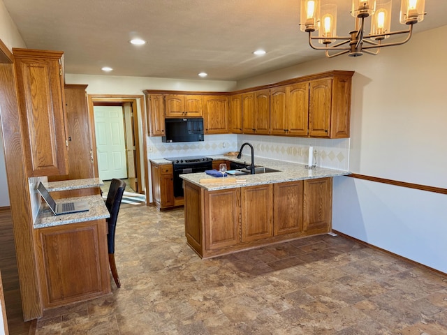 kitchen with black appliances, a peninsula, brown cabinetry, and an inviting chandelier