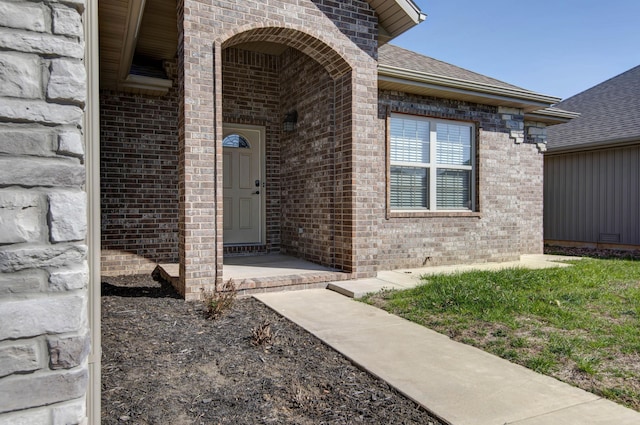 entrance to property with brick siding