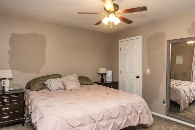 bedroom featuring baseboards, a ceiling fan, and carpet