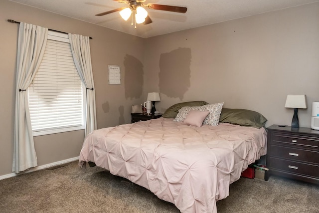 carpeted bedroom with baseboards and ceiling fan