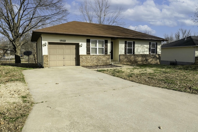 view of front of home with concrete driveway, brick siding, and a garage