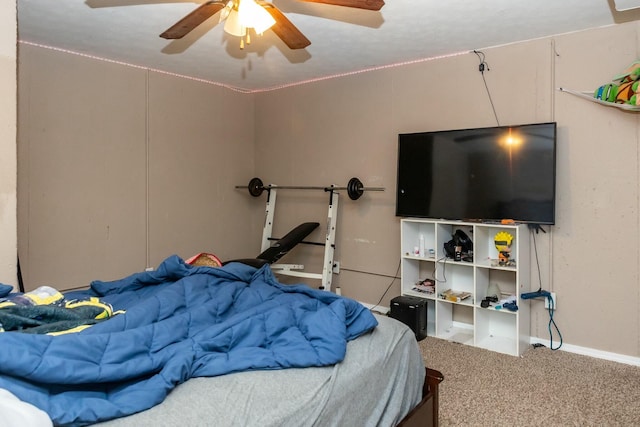 bedroom with baseboards, a ceiling fan, and carpet