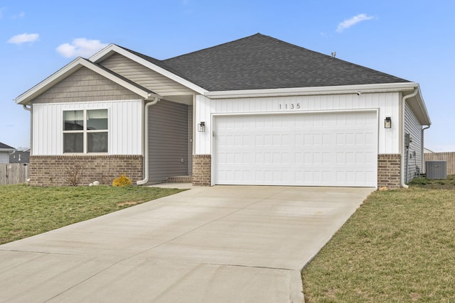 ranch-style house with brick siding, a front lawn, central air condition unit, a garage, and driveway