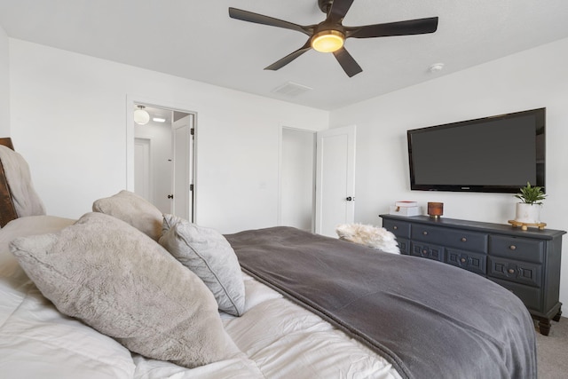 bedroom featuring visible vents, ceiling fan, and carpet floors