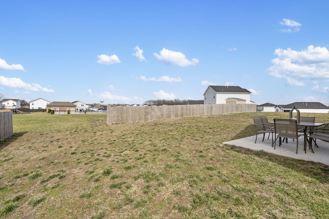 view of yard featuring a patio and fence