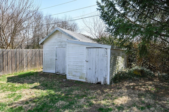 view of shed with fence