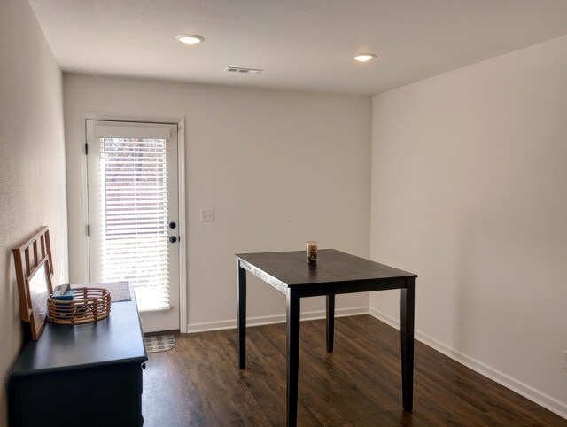 interior space with recessed lighting, visible vents, baseboards, and dark wood-type flooring