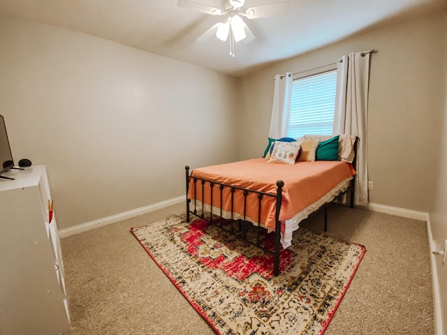 bedroom featuring a ceiling fan, baseboards, and carpet floors