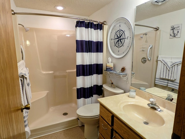 bathroom featuring curtained shower, toilet, vanity, and a textured ceiling