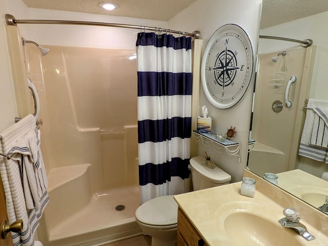 bathroom with a shower with curtain, a textured ceiling, and toilet