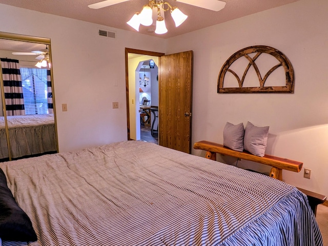 bedroom featuring visible vents and ceiling fan