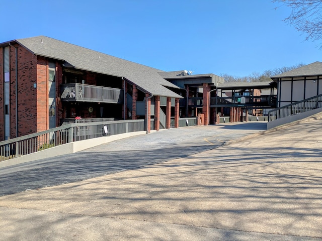 view of building exterior with fence